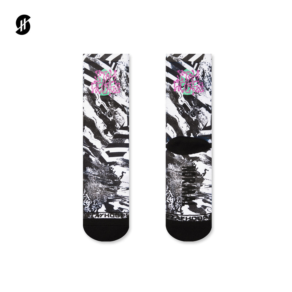 Pair of socks with black and white abstract design and pink floral elements on a white background.
